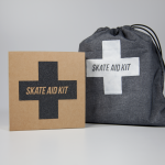 Skate aid kit and a gray sport sack with the logo.