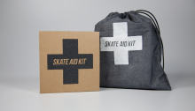 Skate aid kit and a gray sport sack with the logo.